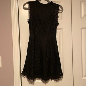 Adorable never worn, black lace dress with open back, size small